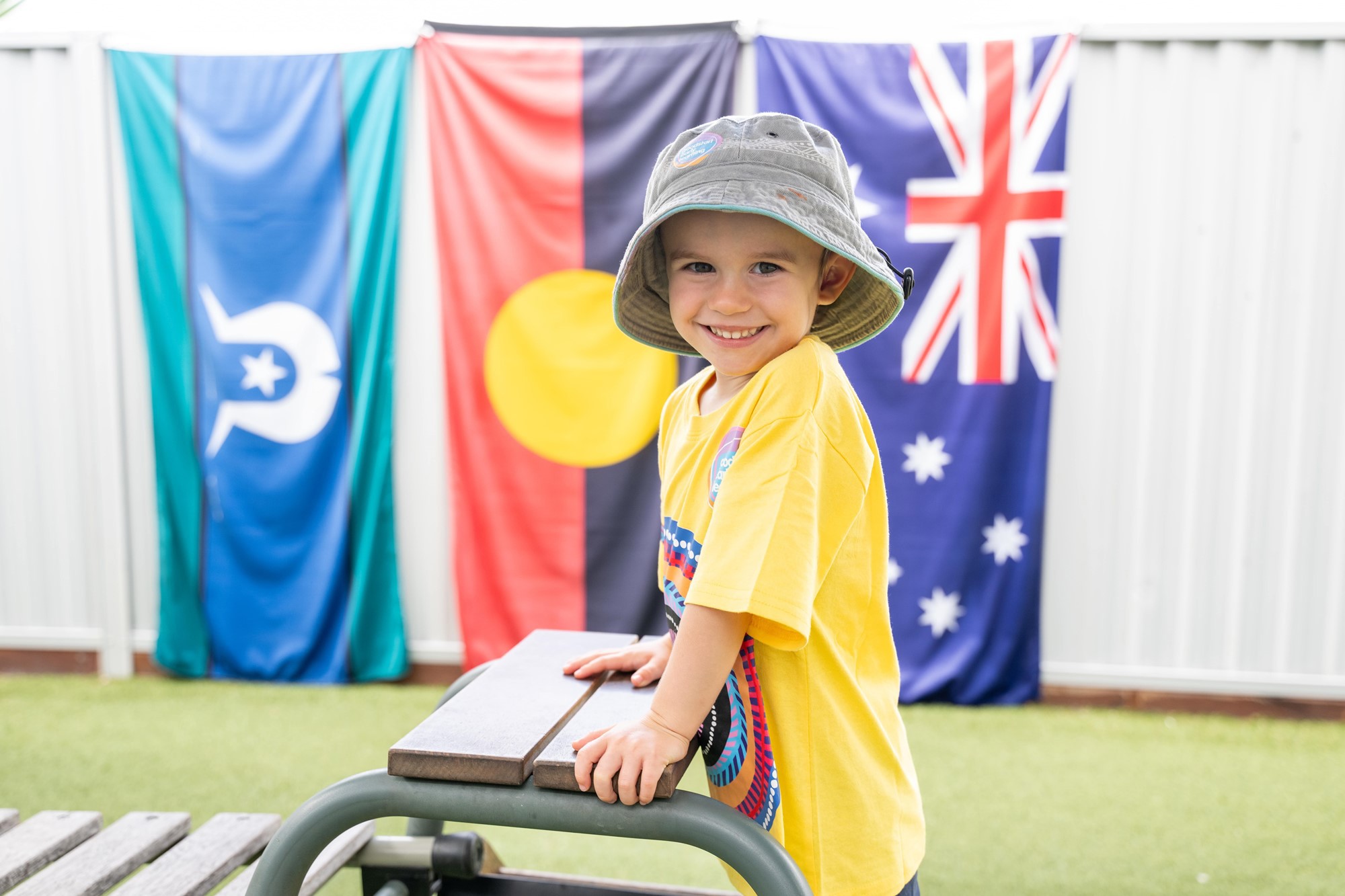 Goodstart-Robina-Groves-boy-kindergarten-shirt-flags-min.jpg